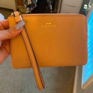 COACH beige wristlet/coin purse